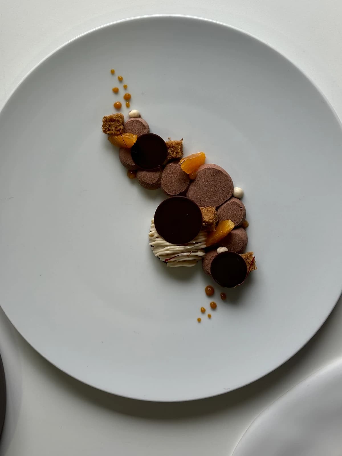 Spiced clementine, citrus genoise sponge, almond crémeux & intense chocolate cream